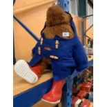 A LARGE VINTAGE PADDINGTON BEAR COMPLETE WITH WELLIES AND COAT