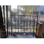 A VICTORIAN STYLE 5' BRASS AND IRON BED HEAD AND FOOT