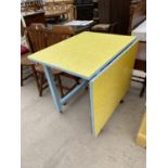 A RETRO FORMICA DROP LEAF KITCHEN TABLE