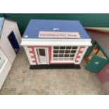 A DOLLS HOUSE, "CAROLINE'S PET SHOP" WITH FURNITURE