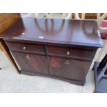 A STAG MINSTREL SIDEBAORD ENCLOSING TWO DRAWERS AND TWO CUPBOARDS, 38" WIDE