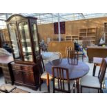 A MORRIS OF GLASGOW DINING TABLE, FOUR CHAIRS AND A TWO DOOR CABINET ON BASE