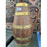 A LARGE WOODEN BARRELL JUG WITH BRASS BINDINGS, HEIGHT 42CM