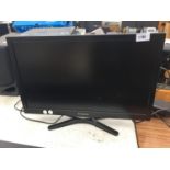 A 23 INCH POLAROID LCD TELEVISION BELIEVED TO BE IN WORKING ORDER BUT NO WARRANTY