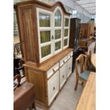 A CONTINENTAL KITCHEN DRESSOR WITH GLAZED UPPER PORTION CUPBOARDS AND DRAWERS TO THE BASE, 63" WIDE