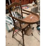 A VINTAGE WOODEN CHILD'S HIGH CHAIR WITH MECHANICAL ADJUSTMENT