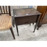 AN SEWING SEWING TABLE WITH HINGED TOP