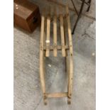 A VINTAGE WOODEN SLEDGE