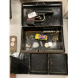 BLACK CASH TIN CONTAINING POLICE PISTOL, CAR KEYRING, WATCHES FACES ETC