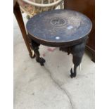 AN INDIAN HARDWOOD CIRCULAR OCCASIONAL TABLE ON THREE LEGS IN THE FORM OF ELEPHANTS, 18" DIAMETER