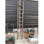 A TWO SECTION 18 RUNG WOODEN LADDER