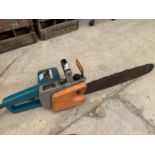 A MAKITA ELECTRIC CORDED CHAIN SAW - W/O