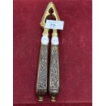 A PAIR OF CARVED WOOD AND BRASS VINTAGE NUT CRACKERS
