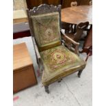 A LATE VICTORIAN FIRESIDE CHAIR