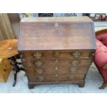 A GEORGE III OAK FALL FRONT BUREAU ON BRACKET FEET, WITH FITTED INTERIOR 37" WIDE