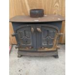 A HEAVY CAST DOUBLE DOOR LOG BURNER, HEIGHT 53CM, WIDTH 61CM, DEPTH 32CM