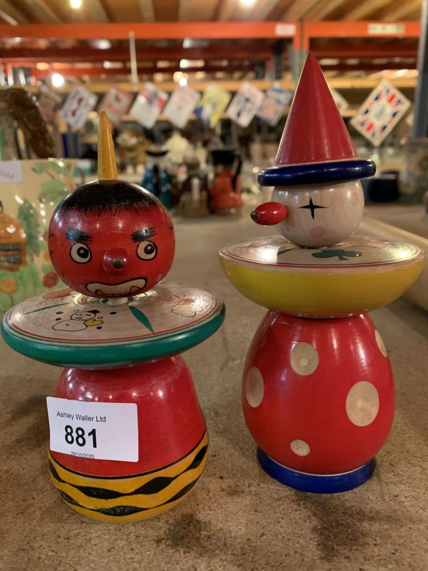 A PAIR OF WOODEN SPINNING TOPS