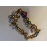 A BRADFORD EXCHANGE ENGLAND BRACELET WITH EIGHTEEN CHARMS