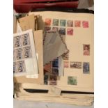 A FOLDER OF STAMPS, SOME SHEETS UNUSED AND MINT