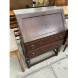 AN EARLY 20TH CENTURY OAK BUREAU, 29" WIDE