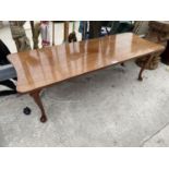 A MAHOGANY COFFEE TABLE ON CABRIOLE SUPPORTS