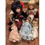 SIX ASSORTED PORCELAIN HEADED DOLLS