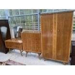 A VINTAGE WALNUT THREE PIECE BEDROOM SUITE COMPRISING TWO DOOR WARDROBE, FIVE DRAWER CHEST AND