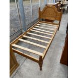 A MODERN PINE SINGLE BEDSTEAD