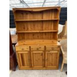 A MODERN PINE DRESSER COMPLETE WITH PLATE RACK, 47" WIDE