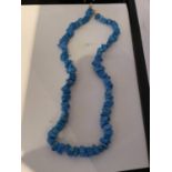 A BLUE CORAL NECKLACE