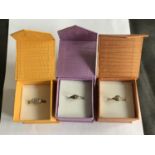 THREE BOXED RINGS STAMPED SILVER AND 925