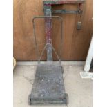 A VINTAGE SET OF AVERY PLATFORM SCALES COMPLETE WITH WEIGHTS