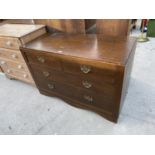 AN OAK CHEST OF TWO SHORT AND TWO LONG DRAWERS