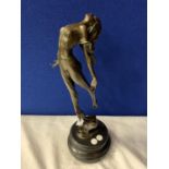 AN ART DECO STYLE BRONZE FIGURINE OF A LADY