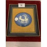A FRAMED BLUE AND WHITE OVAL PLAQUE WITH VELVET BACKING