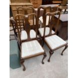 FOUR MAHOGANY EARLY 20TH CENTURY DINING CHAIRS ON CABRIOLE LEGS