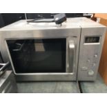A SILVER MICROWAVE OVEN BELIEVED IN WORKING ORDER BUT NO WARRANTY