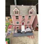 A DOLLS HOUSE WITH FURNITURE