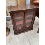 A SMALL MAHOGANY SMOKER'S CABINET WITH TWO GLAZED DOORS