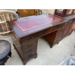 A REPRODUCTION MAHOGANY TWIN PEDESTAL DESK ENCLOSING NINE DRAWERS, WITH INSET LEATHER TOP, 48x24"