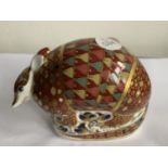 A ROYAL CROWN DERBY ARMADILLO WITH WHITE METAL STOPPER
