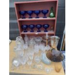 A LARGE QUANTITY OF GLASSWARE TO INCLUDE DECANTERS, WINE GLASSES, BLUE COBALT GLASSES ETC.
