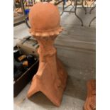 A TERRACOTTA ROOF FINIAL IN A CHESS PIECE STYLE
