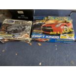 TWO BOXES OF SCALEXTRIC TO INCLUDE FORD ESCORT XR3I AND DRIFT KINGS