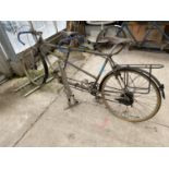 A VINTAGE MACLEANS TANDAM BICYCLE AND A BICYCLE STAND