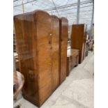 A WALNUT THREE PIECE BEDROOM SUITE - TWO WARDROBES AND A DRESSING TABLE