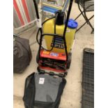 A PUSH LAWN MOWER ALONG WITH A KNAPSACK SPRAYER
