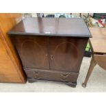 AN INLAID MAHOGANY TV CABINET