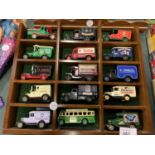 AN ASSORTMENT OF BRANDED DIE CAST REPLICA MODEL VEHICLES WITH DISPLAY CASE TO INCLUDE 'H SAMUEL' AND