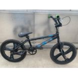 A BMX STUNT BIKE WITH TWO FRONT PEGS AND ONE REAR PEG